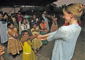 Kristin Cooper at the Homes of Hope working to connect, volunteers, donors, yoga students and yoga teachers with the people who need their help, both at home and abroad.